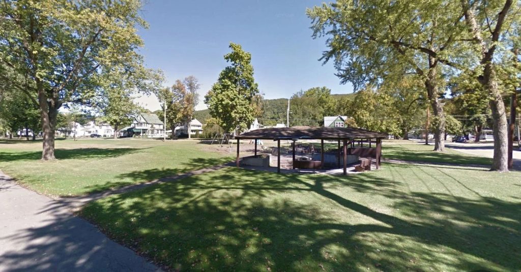 Village of Painted Post Rand Avenue Park brown pavilion surrounded by green grass